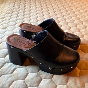Elegant Black Mules with Stud Accents